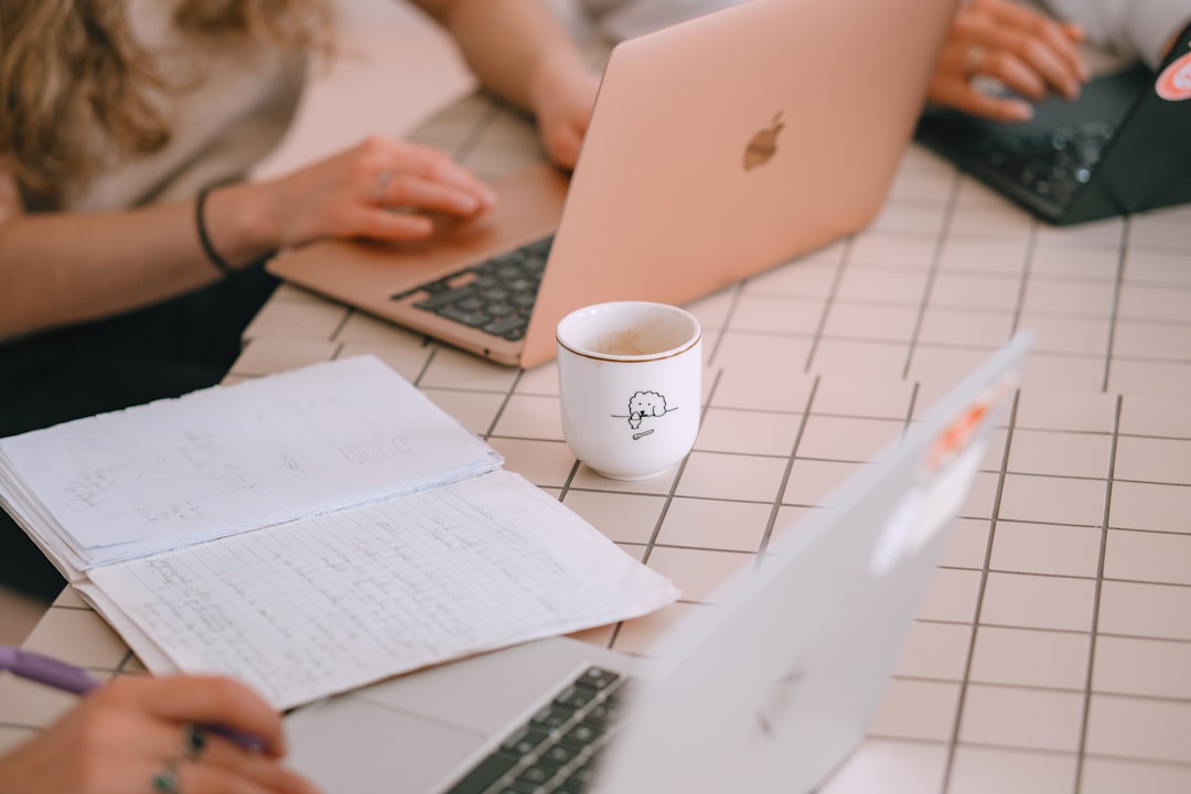 people-working-on-laptops-with-notebooks-and-notebooks-ly8nzu7nsdg